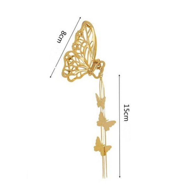 Pince cheveux papillons dorés.