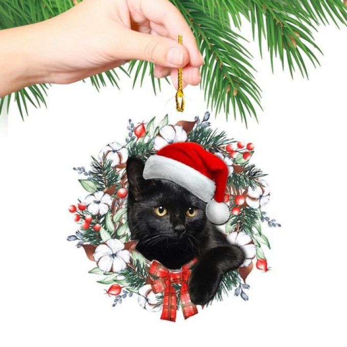Décoration de noel chat noir en acrylique au milieu des fleurs.